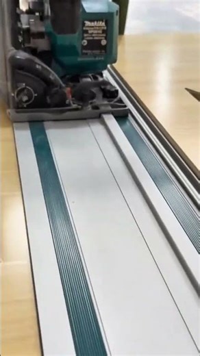 Using a track saw to make precise longitudinal cuts on wood panels with high accuracy and efficiency