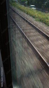 Railroad train tracks in motion. High speed transportation railway track in Vertical Video