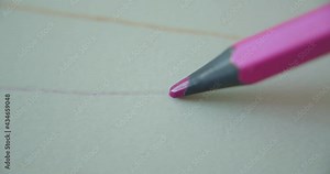 Purple graphite pencil color draws a straight line on a white background of paper, special paper for the artist, macro shot. Human lines. Figure Concept, Art