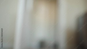 young athletic woman lacing up her pink running shoes at home