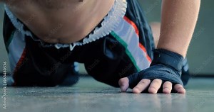 Professional boxer, do push-ups, in a good body, elastic bandages, punches bag. Concept: to love sports, training, endurance, willpower, technique, strategy, defense, stance, muscles, reaction