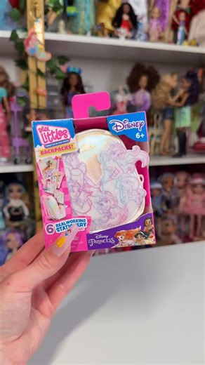 Dasha ♡ on Instagram: "Disney Real Littles princess backpack 🩷 I LOVEEEE any merch that offers a crossover between our princesses & this one has such a nice color scheme, it’s so whimsical 🧚🏼‍♀️ 👑 disney princess, disney merch, disney collector, mini doll accessories, mystery box, blind box, surprise toy, stationery #disneyprincess #disneymerch #disneycollector #mysterybox #surprisetoy"