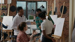 Multiethnic group of students learning to draw sketch together in art class, using pencil and canvas to create vase model for personal growth. Workshop for drawing skills development.