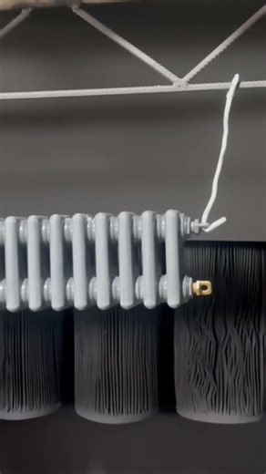 The steel column radiator is being sprayed