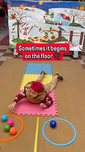 *Tummy time strength* Lying on the stomach and passing the balls helps strengthen core muscles, arms and shoulders while improving coordination and body control while playing 💪✨ #sunriseldh #fblifestyle #earlychildhoodeducation #PlayBasedLearning #activitiesforkids | Sunrise Nursery School