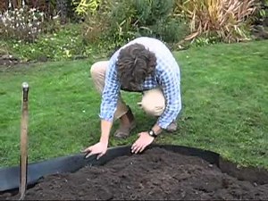 How to install recycled plastic lawn edging roll around flower bed. Enjoy neat border and lawn edge
