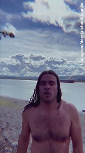 Derek Richard Thomas pops his top off and goes for a solo swim under the sun