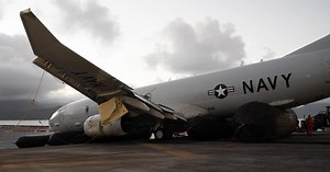 Video shows Navy plane resting on coral reef