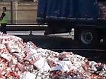 Lorry crash sends thousands of Coke cans onto major UK road