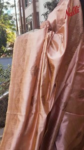 There’s something about this raw silk saree that makes you fall in love with it the moment you wear it. The soft, breathable fabric flows so effortlessly with every step, like a quiet breeze on a perfect morning. The delicate floral motifs bloom across the drape, while the textured finish adds just the right touch of depth—simple, timeless, and full of grace. With every fold, the saree catches the light, moving gently, as if it’s made just for you. It feels comforting, like a warm hug, yet fresh