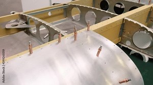 Demonstration of the aircraft wing structure. Sectional plane wing. Front, rear spar, rib, flap, slat and other wing elements. Closeup view