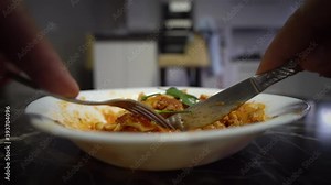 Man eating Neapolitan lasagna, pov