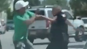 Watch as cop & driver throw punches 'like 7-year-olds' in hilarious street bout