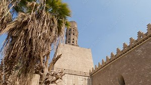 Al-Hakim Mosque with magnificent minaret, Islamic Cairo, Egypt. Locked off lookup up shot