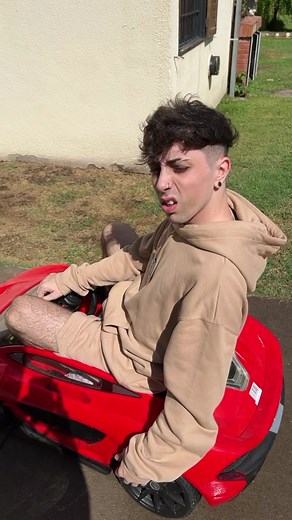 Carre's Joyride in a Red Toy Car