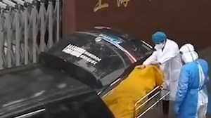 Shanghai morgue workers open body bag to discover 'corpse' is alive