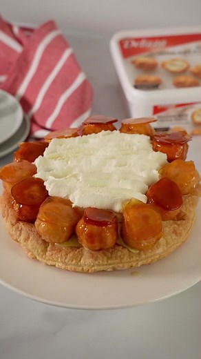 Savor our simplified St. Honoré cake, a nod to the classic French dessert named after the patron saint of bakers and pastry chefs. Using Delizza Belgian Mini Cream Puffs, we’ve made it simple without sacrificing taste. Crisp pastry meets velvety chiboust cream for a timeless treat. Find the full recipe at the link in our bio. . . . #creampuff #chouxpastry #sthonore #dessertoftheday #profiteroles #dessert #cakedecorating #cake