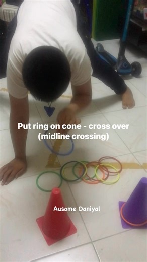 Put ring on cone - cross over (midline crossing) #ausomedaniyal #autismsupport #OccupationalTherapy #midlinecrossing #exercise | Maria Theresa Gines Iqbal