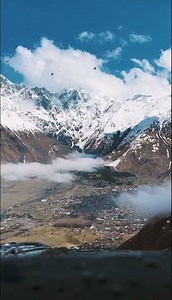Snowy Mountain Village in 4K Ultra HD | Dramatic Clouds & Majestic Peaks