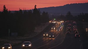 Highway Traffic at Sunset Along the Mountain