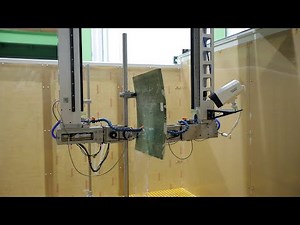 Multi-axis water spray through transmission ultrasonic testing system