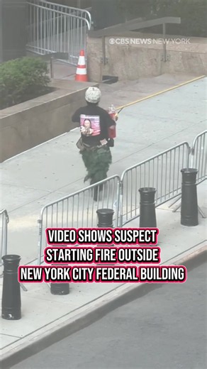 Video from outside 26 Federal Plaza in New York City shows a man dumping items onto the ground before flames erupt and fireworks begin going off Monday morning. Authorities say preliminary information indicates fireworks inside a garbage can exploded, prompting a response from the FDNY. A man was taken into custody, and the FBI is investigating the incident. #newyork #nyc