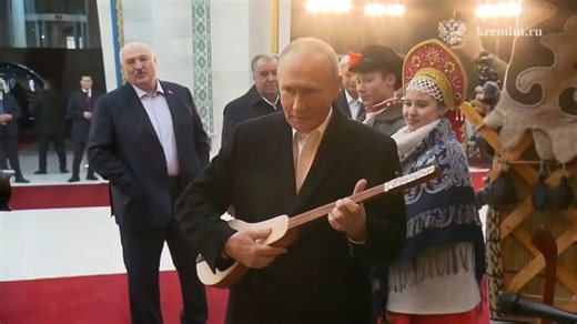 Russia’s president receives a quick music lesson on the komuz