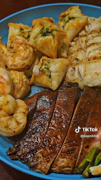 Grilled Cod,Gulf Shrimp,Portabella Mushrooms with Bacon Wrapped Asparagus and Mini Spanikopita.....#fyp #sapobbq #grilling #shrimp #fish