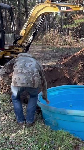 Digging dirt for a small pond or waterhole with a CAT 303.5 Excavator