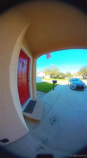 the surveillance show on Instagram: "A Ring doorbell camera captured an incredible moment of quick reflexes during a routine package delivery. The UPS driver was navigating a tricky front porch when a near-disaster almost unfolded. On a crisp November afternoon, the driver approached the house with a carefully packaged box, unaware of the small welcome mat that would soon challenge his balance. Just as he pressed the doorbell, his foot caught the edge of the mat, sending him momentarily off-bala