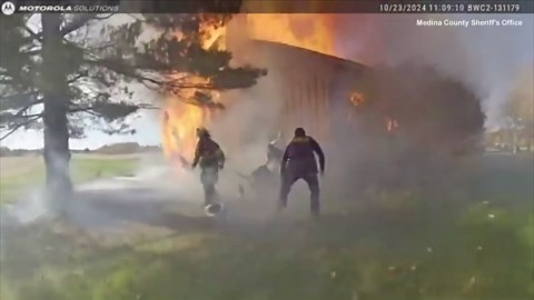 Trapped Woman Pulled From Basement Window as House Is on Fire