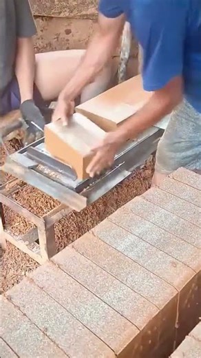 Cutting clay bricks using manual hand saw