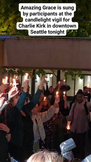 Amazing Grace is sung by participants at the candlelight vigil for Charlie Kirk in downtown Seattle tonight | Ari Hoffman