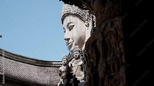 statues of faces at a Thai temple