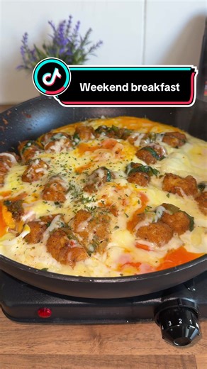 Slow weekend breakfast! Crispy hash brown bites with eggs🥔 🍳 Recipe * Air fried hash browns bites * 2 tsp oil * 1 chopped onion * 1/2 green pepper * 1 tsp smoked paprika * 1 tsp garlic granules * 1/2 tsp mixed herbs * 1/2 tsp chilli flakes * Salt and pepper to taste * Dash of water * Chopped spinach * 4-5 eggs * Greated cheddar cheese * Greated mozzarella cheese Air fry the hash brown bites for 13 minutes at 190°C Heat oil on a medium heat and sauté onion and green pepper till lightly browned,