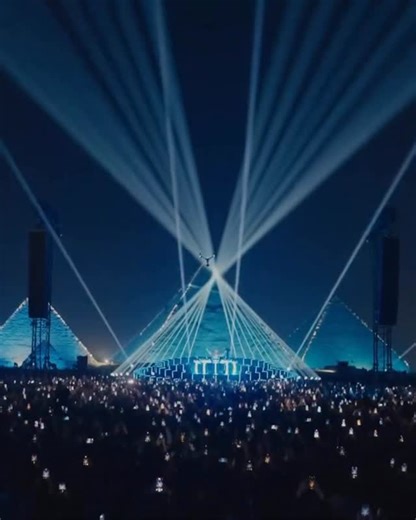 PMW Projection Mapping & New Media Arts on Instagram: "Facing one of the most iconic landmarks in human history, Tiësto headlined an unprecedented event, performing for three hours in front of the Pyramids of Giza. The nighttime show, streamed live to a global audience, transformed the Egyptian desert into a stage where electronic music conversed with ancient history. The set was conceived as a musical journey through different phases of his career, combining trance, EDM, and tracks that defined