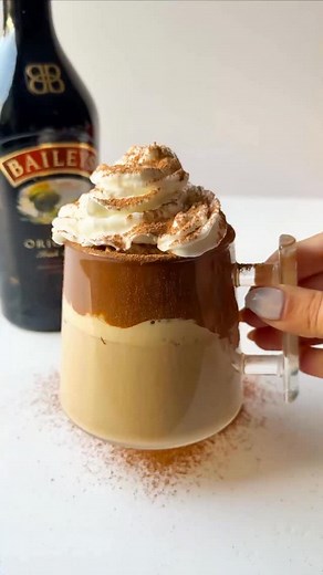 I made a hot version of my Whipped Baileys Coffee and OMG… this is dangerously good ☕🤎✨Creamy, warm, cozy perfect for this season !! Recipe : • Add 1 tbsp instant coffee • Add 1 tbsp sugar • Pour 3–4 tbsp hot water → Whip directly in the mug until thick and fluffy Then add: • 1 shot Baileys • Hot milk • Whipped cream on top . Sprinkle some cocoa powder (optional ) • (Optional) Swirl Nutella inside the mug before starting 🤎✨ #whippedcoffee #dalgonacoffee #hotlatte #baileysirishcream #coffeegirl