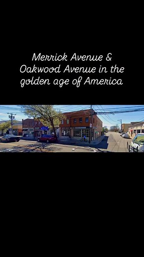 A black and white panorama photograph of #Merrick Avenue facing south west. In the distance, the rail road crossing is in view and automobiles traveling on Merrick Avenue are visible. The Merrick fish market, Quality bakery, Merrick Delicatessen and Rahn’s are some of the stores in view | Frank Jurs, Realtor and Historian