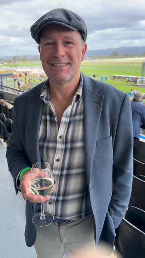 Terry chats with John Macmillan, Jamie Melham’s boss while she was an apprentice, about watching her win the race that stops the nation. | Atkins Photography