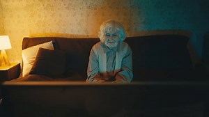 clip-3428135803-happy-old-woman-watching-night-comedy-show