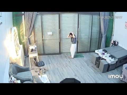 Mouse Falls on Woman's Head While Closing Metal Rolling Shutter