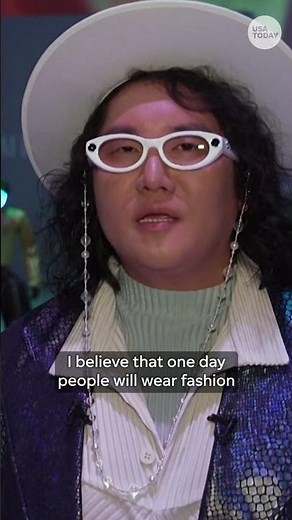Robots and human models walk the runway in matching outfits in Seoul