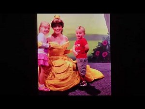 Beautiful Princess Belle sharing a great big group hug with 2 kids at Walt Disney World Florida