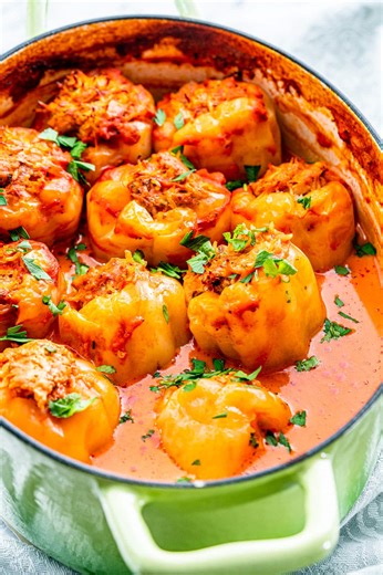 Romanian Stuffed Peppers (Ardei Umpluti) uses sweet yellow Hungarian peppers, stuffed with a mixture of ground pork, rice and herbs and slowly cooked in a simple tomato sauce with sour cream. It’s a taste of the old country that is to die for! One 5 STAR reviewer said "Followed the recipe exactly as written. Delicious! My family loved it especially my Romanian husband." Want to try the recipe out yourself?! The recipe link is in the comments 👇 #JoCooks #CravingHomeCookedBlog #EasyDinner #EasyRe