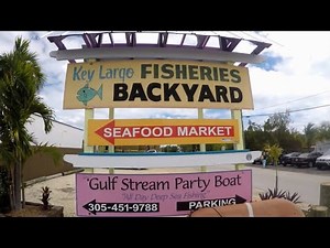 Key Largo Florida Restaurant "Key Largo Fisheries Back Yard" by the water and fish market and Marina