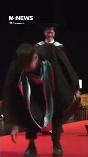 University Graduates Fails Backflip At Graduation