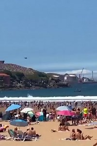 A Spanish F-18 fighter jet performed an evasive manoeuvre on Sunday after encountering a flock of birds during an air show in Gijon, Asturias, Spain, an eyewitness video showed. Reuters was able to confirm the location by the buildings and coast layout which matched file and satellite imagery of the area. The airshow website and additional information from the source verify date. The incident occurred during Gijon's annual air show that attracts hundreds of spectators to the northern coastal cit