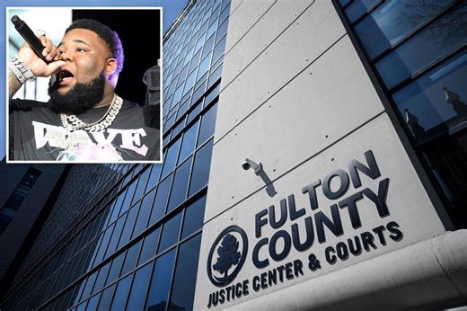 Rapper Rod Wave faces more than a dozen charges, some involving a gun, after turning himself in