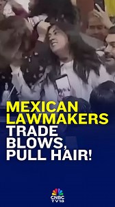 A debate over the dissolution of Mexico City's transparency institute turned chaotic as lawmakers started trading blows & pulling hair to protest the measure. #Watch #Mexico #Parliament #Lawmakers #Chaos #CNBCTV18Digital #MexicoCity | CNBC-TV18