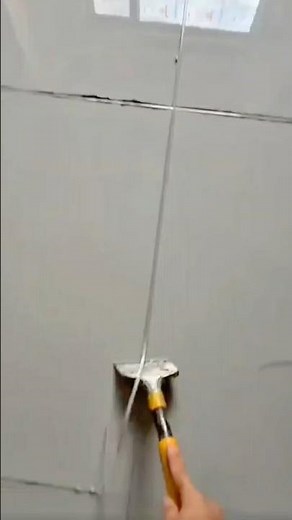 Cleaning Tile Grout Removing Old Residue with a Scraper tool